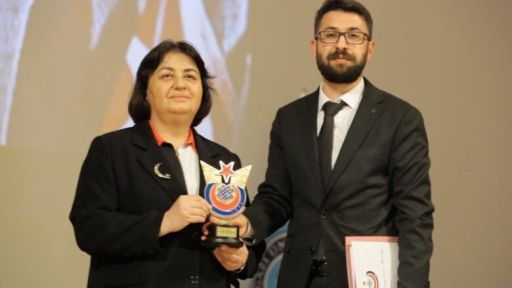 Işık Sadık Ahmet presented with Dr. Sadık Ahmet's file at the Faculty of Medicine