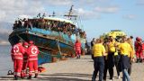 Boat with hundreds of migrants safely towed to Cretan port
